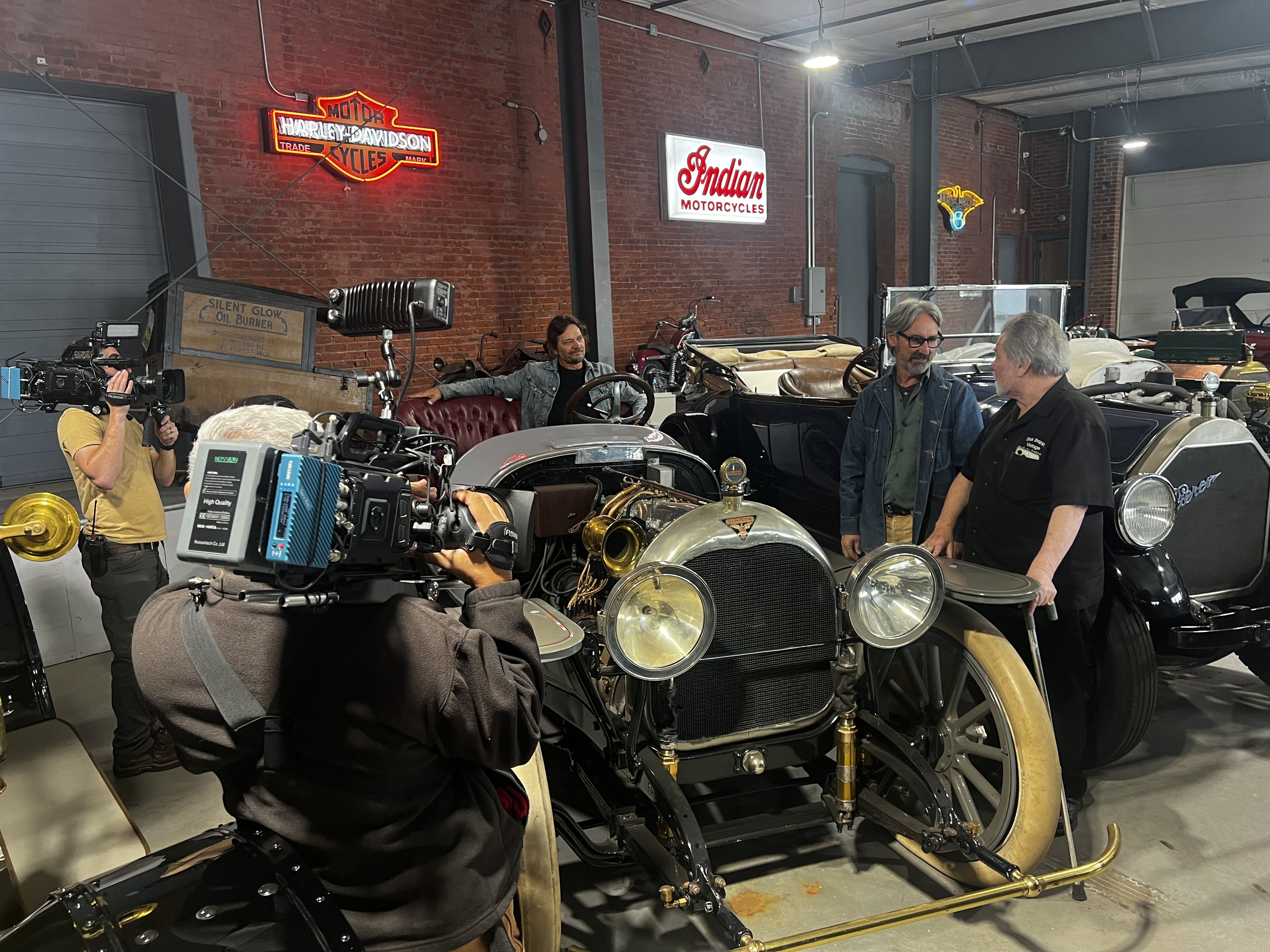 Dick giving details about his 1915 Crane Simplex in his new downtown showroom.